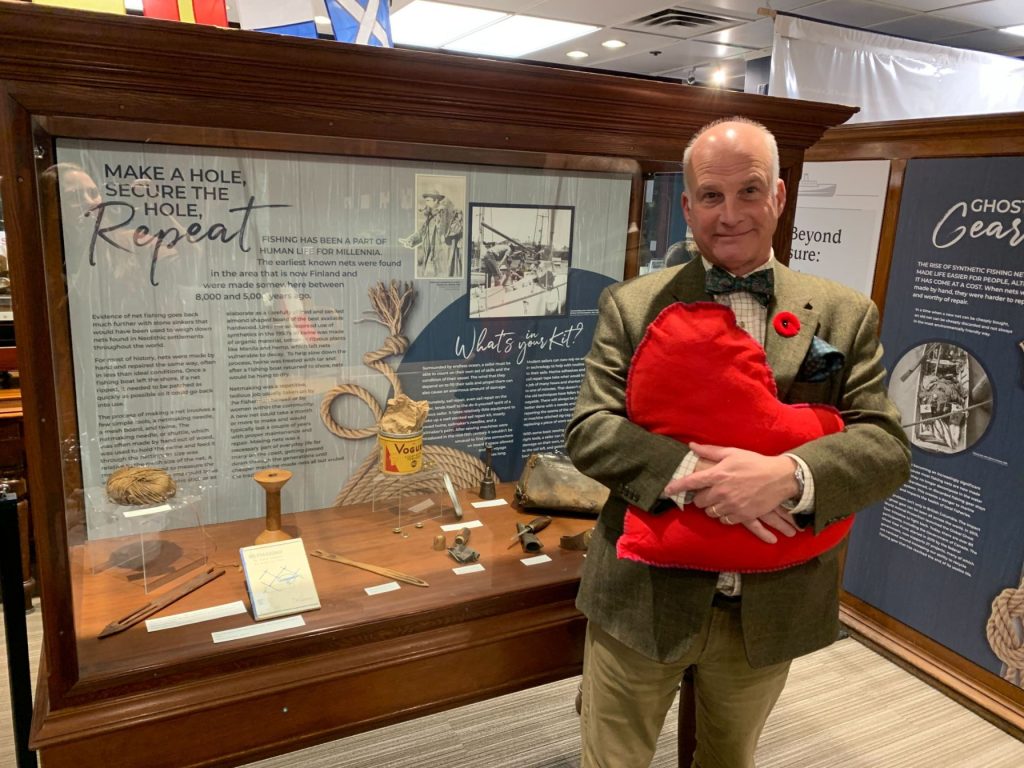 President of the Board Jamie Webb poses in the new exhibit